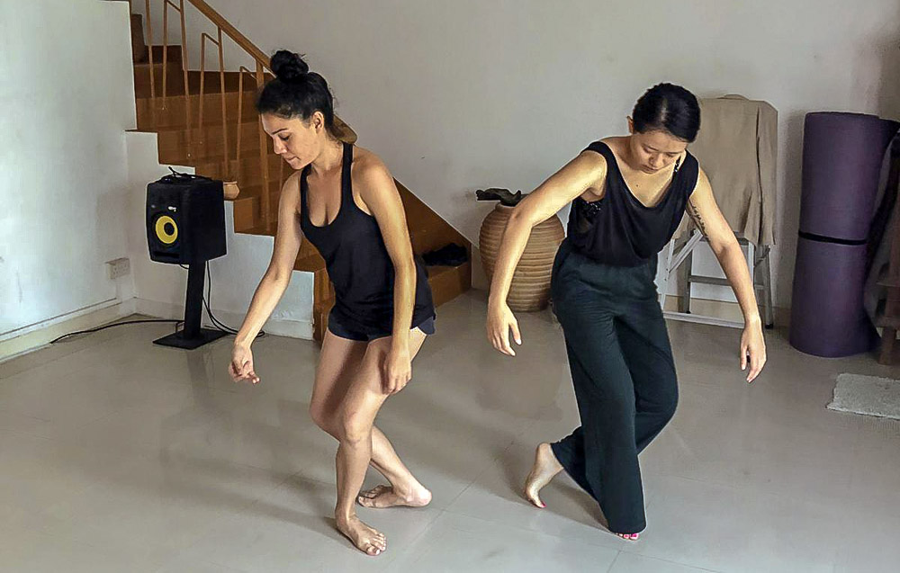 Sharda Harrison (left) rehearsing the Pink Gajah Theatre performance response "De-Construction" with Sonia Kwek (right). Image: Sharda Harrison