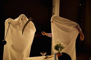 2 actors in sheet ghost costumes.